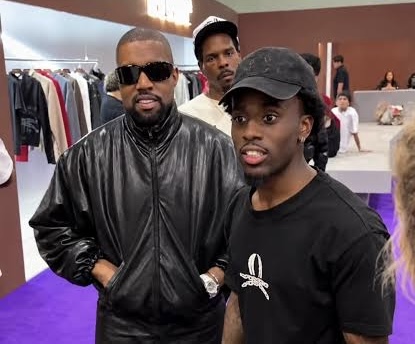 Ye stops by Kai Cenat’s Vivet booth at ComplexCon and looks over the brand’s boots